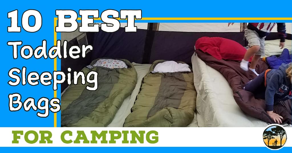 Two little kids playing on inflatable mattress with sleeping bags and words "10 best toddler sleeping bags for camping"