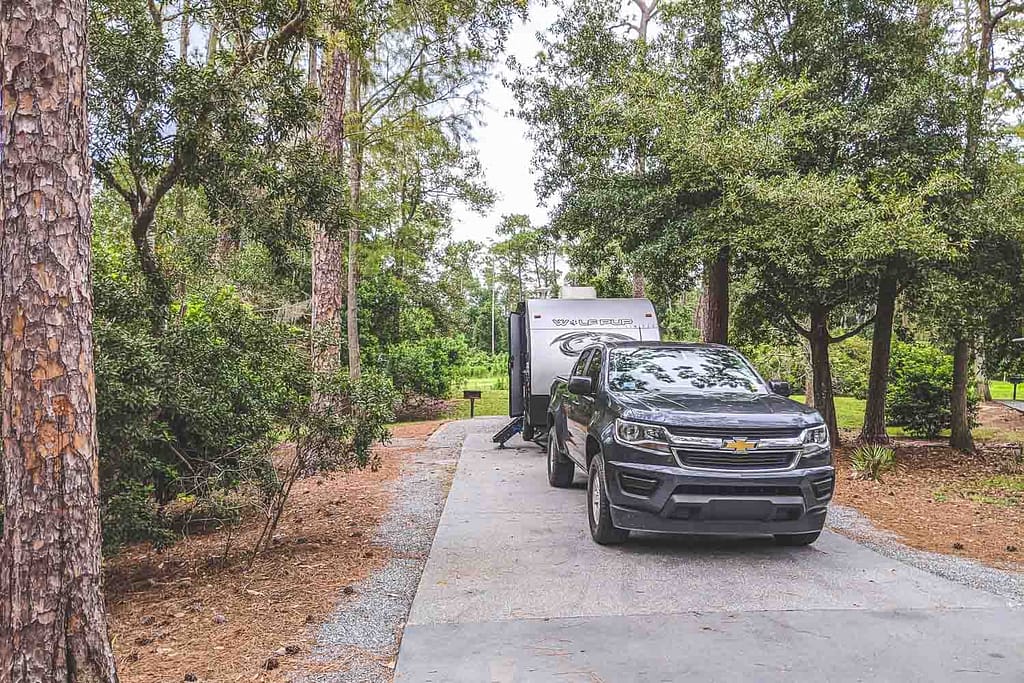 Disney's Fort Wilderness Full-hookup site with greay truck and small travel trailer