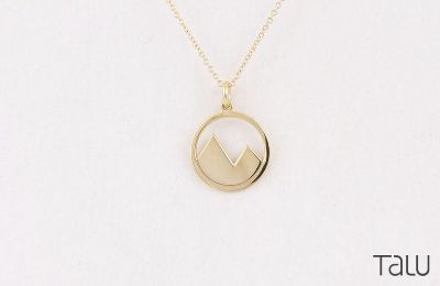 golden necklace with mountain charm