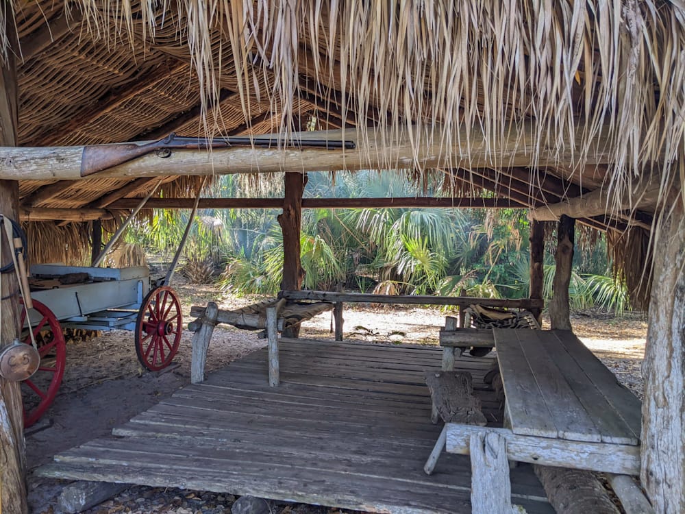 Cow camp at Lake Kissimmee State Park showing two cots and a carriage 